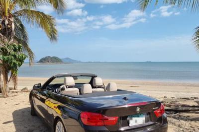 A luxury convertible vehicle will collect you from the hotel, airport, or any designated l